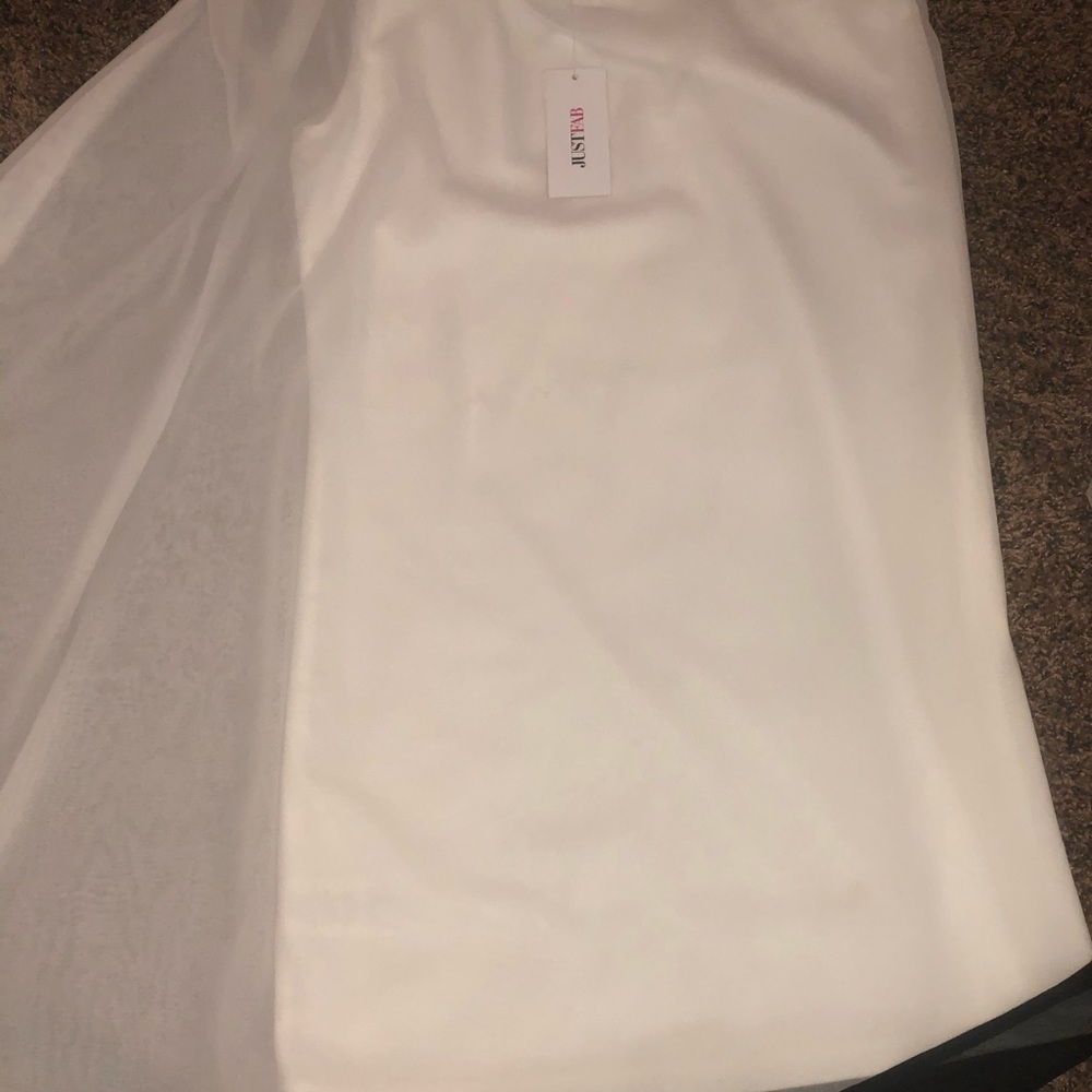 White one shoulder dress. White fitted dress